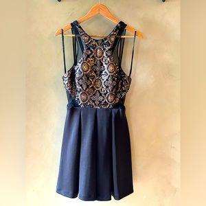 Faviana size 10 black cocktail dress with gold and bronze sequins bodice.